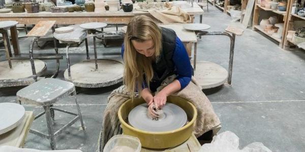 Student in wheel throwing class