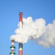 Smoke Stacks Against Blue Sky